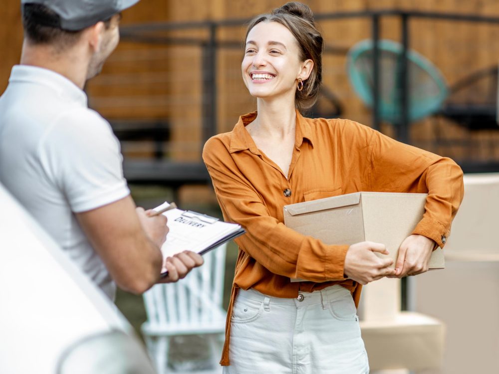 couriers-delivering-goods-to-a-woman-home-2021-09-15-16-45-26-utc.jpg