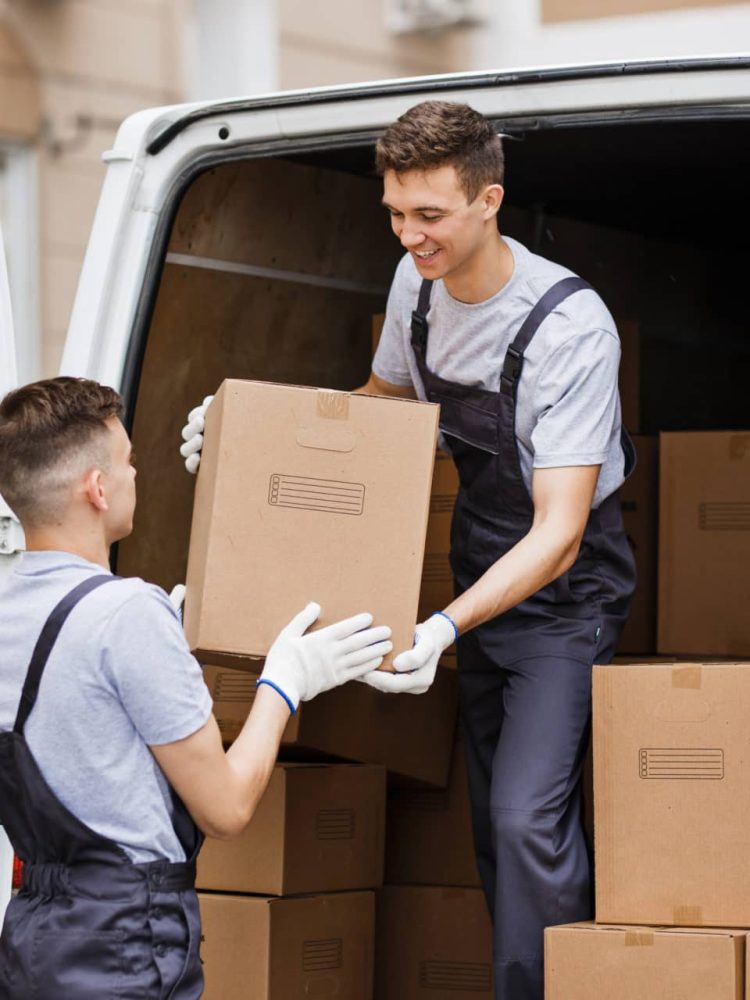 two-young-handsome-movers-wearing-uniforms-are-unloading-the-van-full-of-boxes-house-move-mover-2-e1694426476985.jpg